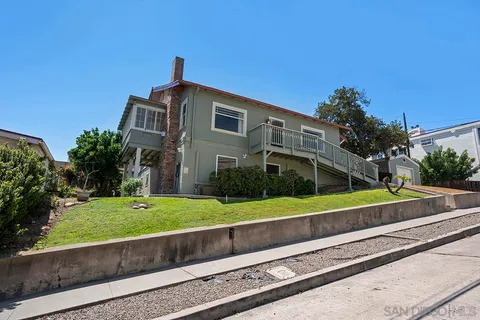 a house view with a garden space