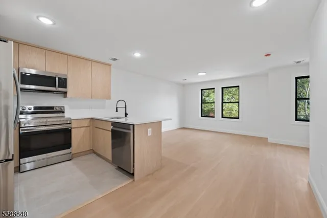 a kitchen with a sink and a stove top oven