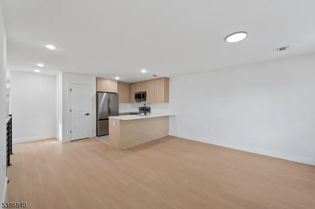 a view of kitchen with wooden floor