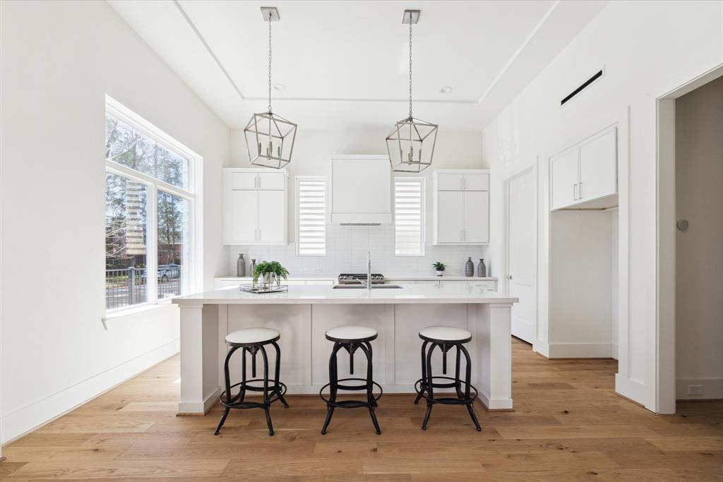 5302 Wembley Downs Drive Houston, TX 77091 - Photo 1 of 30 a kitchen with a table and chairs in it