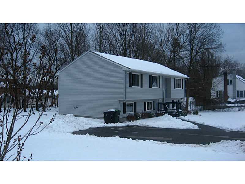 43 Benoit Street Coventry, RI 02816 - Photo 1 of 10 Exterior Front. One third acre lot, with mature trees and shrubs.