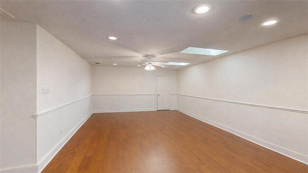 7451 County Road 1509 Athens, TX 75751 - Photo 19 of 36 a view of a room with an empty space and a ceiling fan