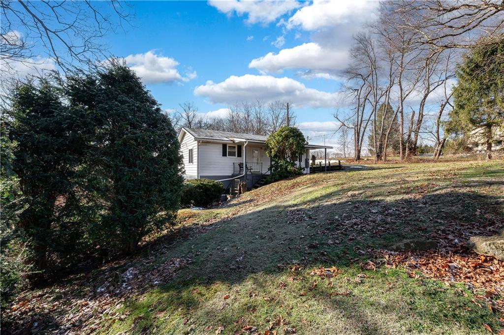 325 East Brewster Road Butler, PA 16001 - Photo 3 of 36 a view of a house with a yard