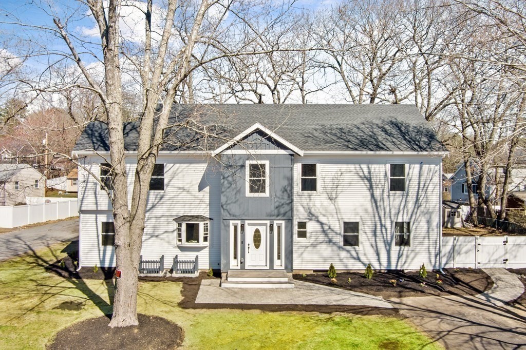 20 Mohawk Road Burlington, MA 01803 - Photo 1 of 39 a view of a house with yard chairs and floor to ceiling windows