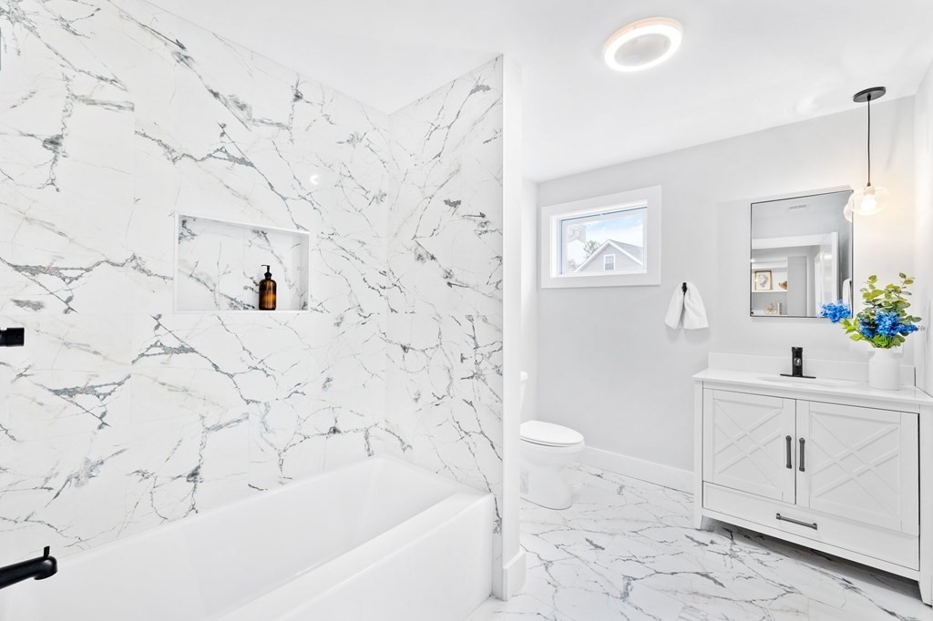 20 Mohawk Road Burlington, MA 01803 - Photo 20 of 39 a bathroom with a sink a toilet and a bathtub