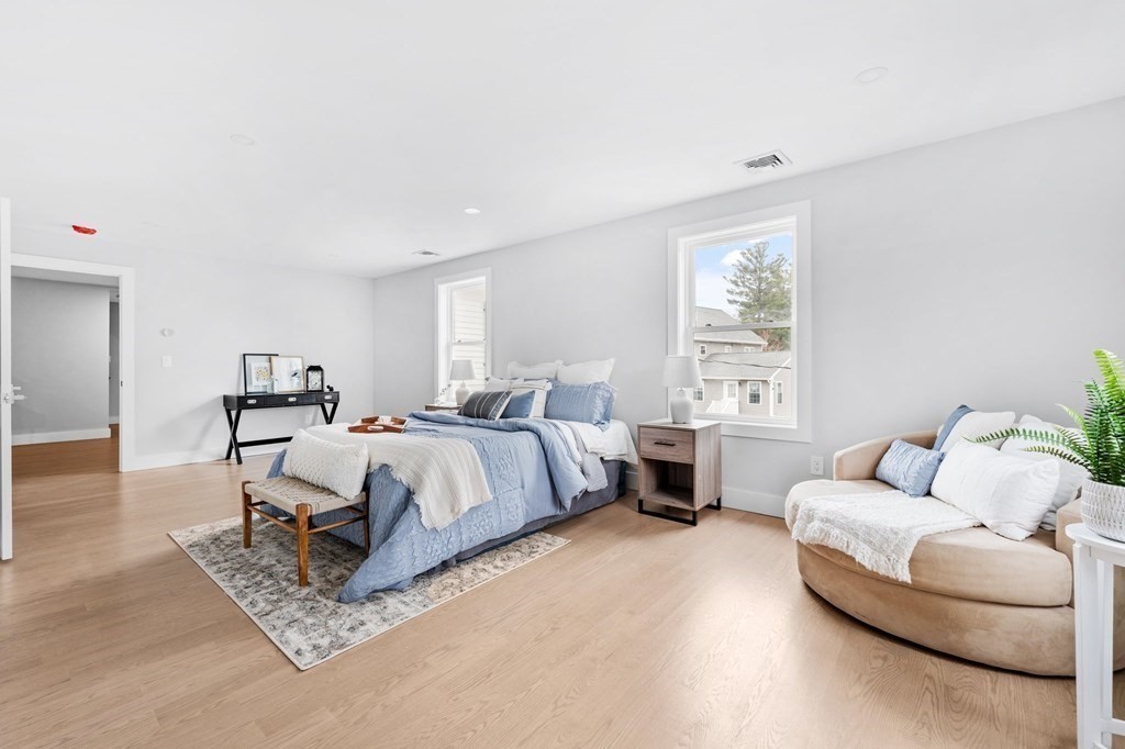 20 Mohawk Road Burlington, MA 01803 - Photo 21 of 39 a spacious bedroom with a bed and a couch