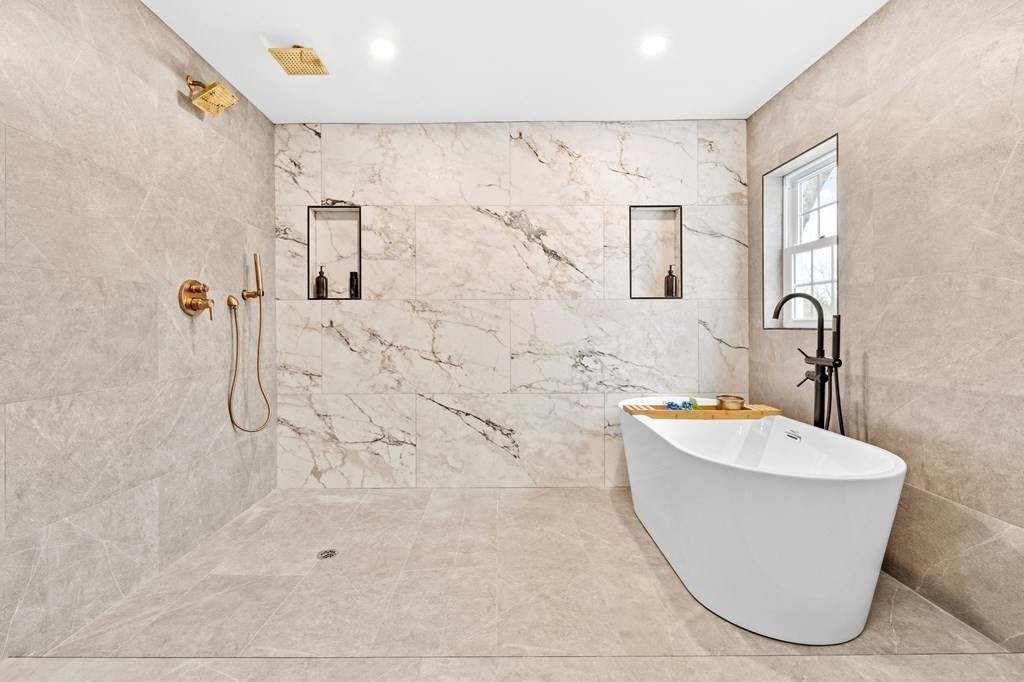 20 Mohawk Road Burlington, MA 01803 - Photo 23 of 39 a bathroom with a bathtub sink mirror and toilet