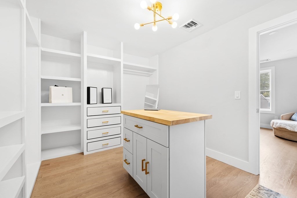 20 Mohawk Road Burlington, MA 01803 - Photo 24 of 39 a kitchen with white cabinets and white appliances