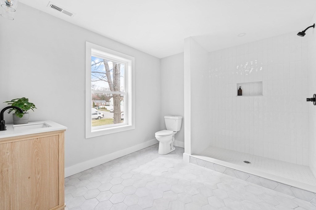 20 Mohawk Road Burlington, MA 01803 - Photo 29 of 39 a bathroom with a toilet sink and shower