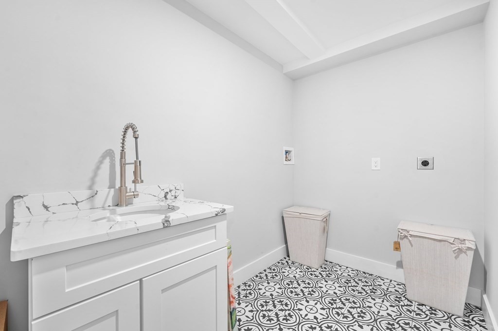 20 Mohawk Road Burlington, MA 01803 - Photo 30 of 39 a bathroom with a sink a toilet and a mirror