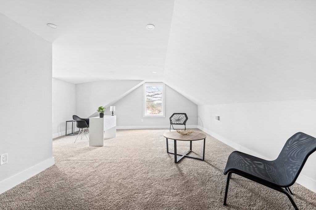 20 Mohawk Road Burlington, MA 01803 - Photo 34 of 39 a living room with furniture and a clock