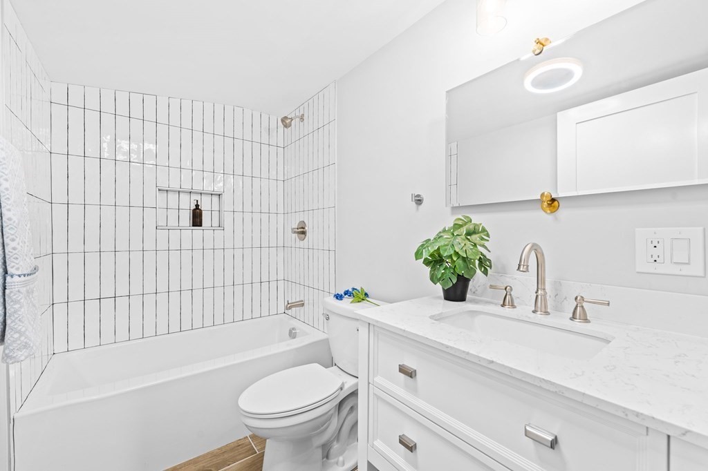 20 Mohawk Road Burlington, MA 01803 - Photo 35 of 39 a bathroom with a sink a toilet and shower