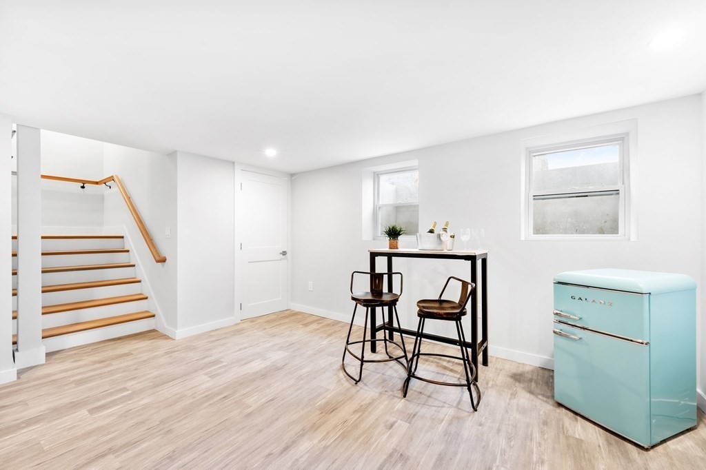 20 Mohawk Road Burlington, MA 01803 - Photo 36 of 39 a workspace with furniture stairs and a window