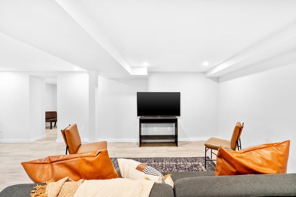 20 Mohawk Road Burlington, MA 01803 - Photo 37 of 39 a living room with furniture and a flat screen tv