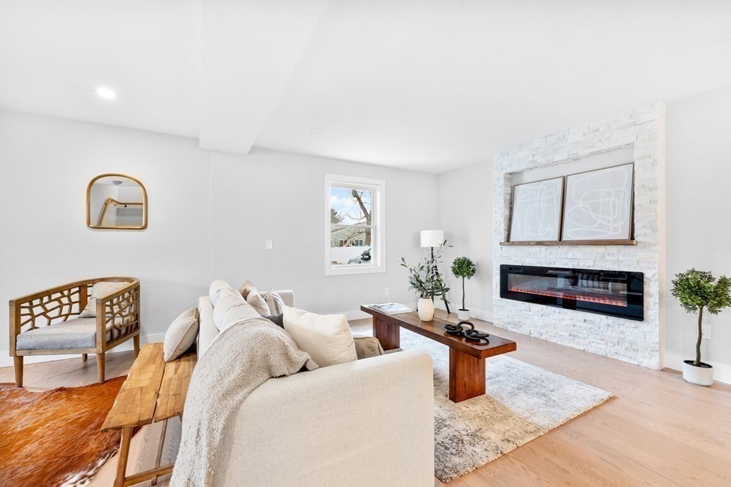 20 Mohawk Road Burlington, MA 01803 - Photo 4 of 39 a living room with furniture a fireplace and window