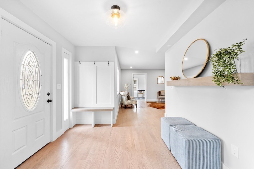 20 Mohawk Road Burlington, MA 01803 - Photo 6 of 39 a view of living room filled with furniture and a chandelier
