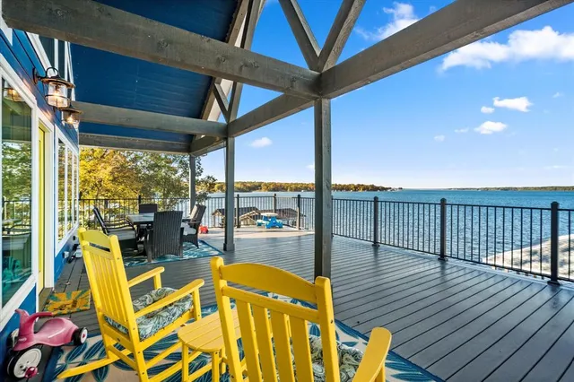 a swimming pool with outdoor seating