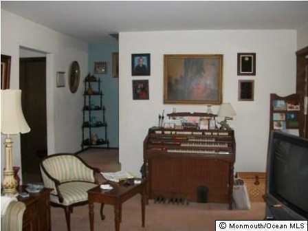 27 Mandalay Road Brick, NJ 08723 - Photo 3 of 3 a living room with furniture and a flat screen tv