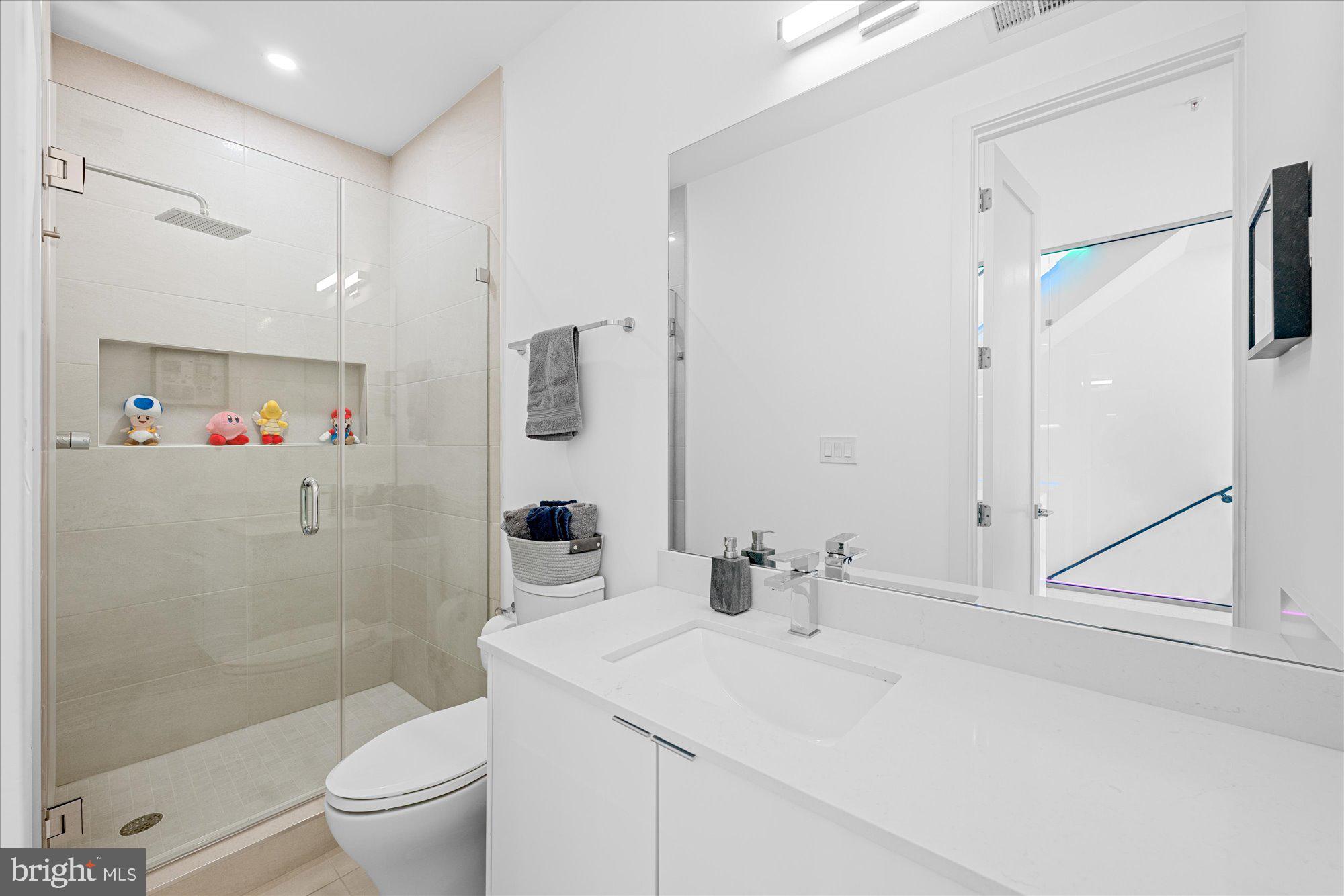 1715 North Capitol Street Northeast, Unit 7 Washington, DC 20002 - Photo 16 of 28 a bathroom with a sink toilet and shower