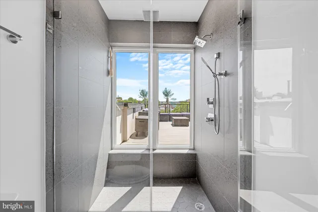 a bathroom with a double vanity sink toilet and a tub