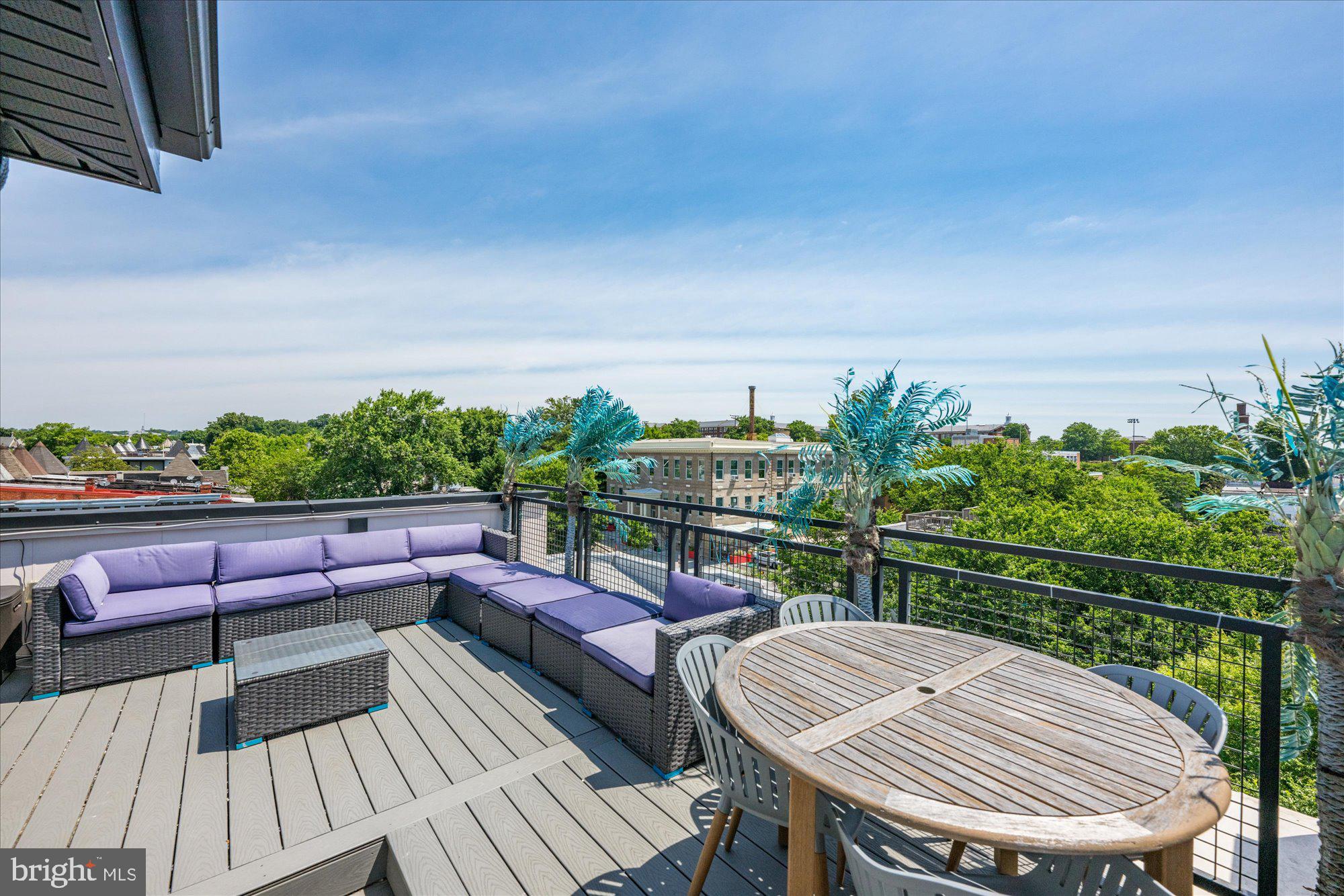 1715 North Capitol Street Northeast, Unit 7 Washington, DC 20002 - Photo 24 of 28 a view of deck with seating area and trees