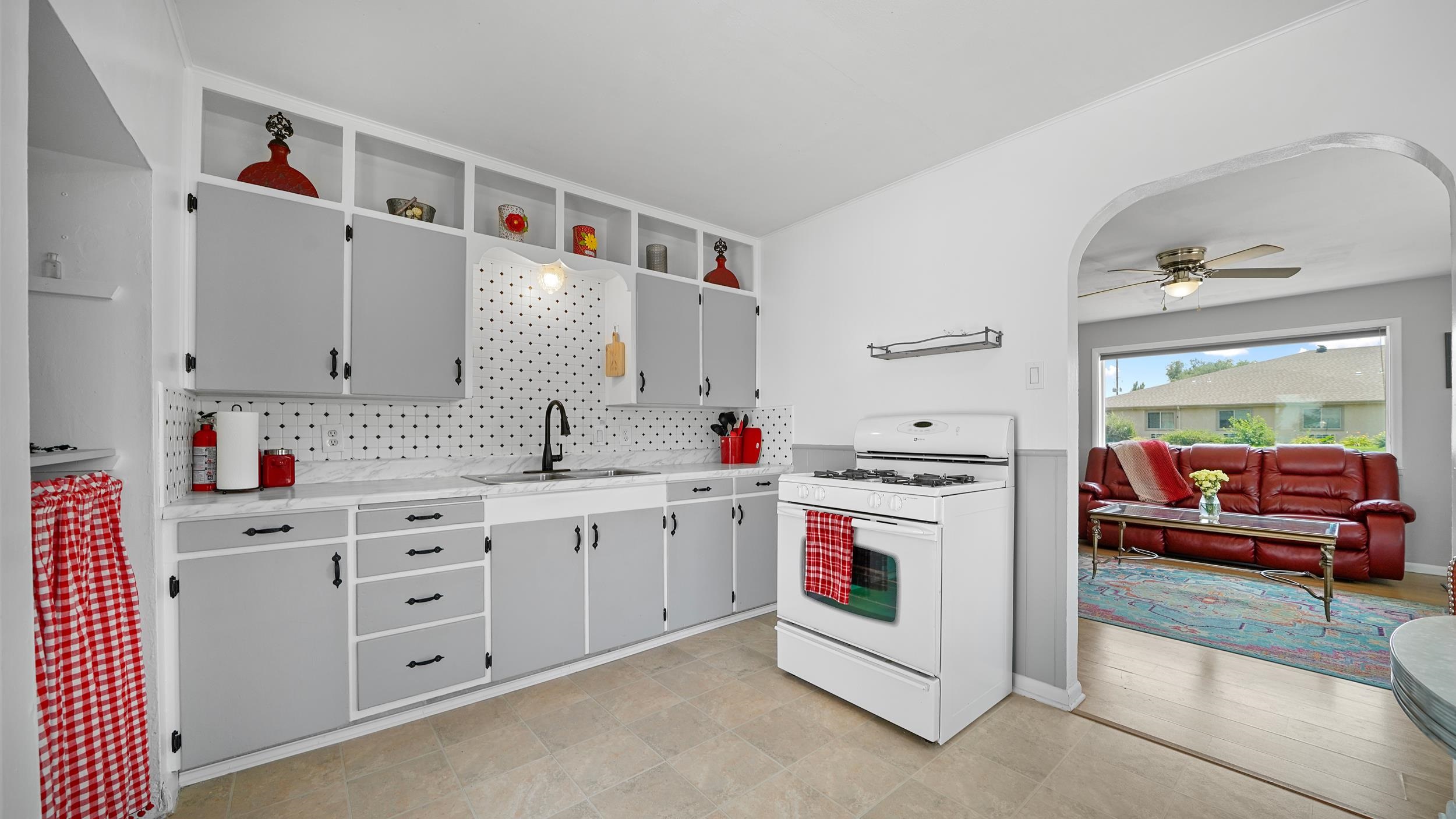 2396 H Road Grand Junction, CO 81505 - Photo 12 of 30 a kitchen with cabinets a sink and white appliances