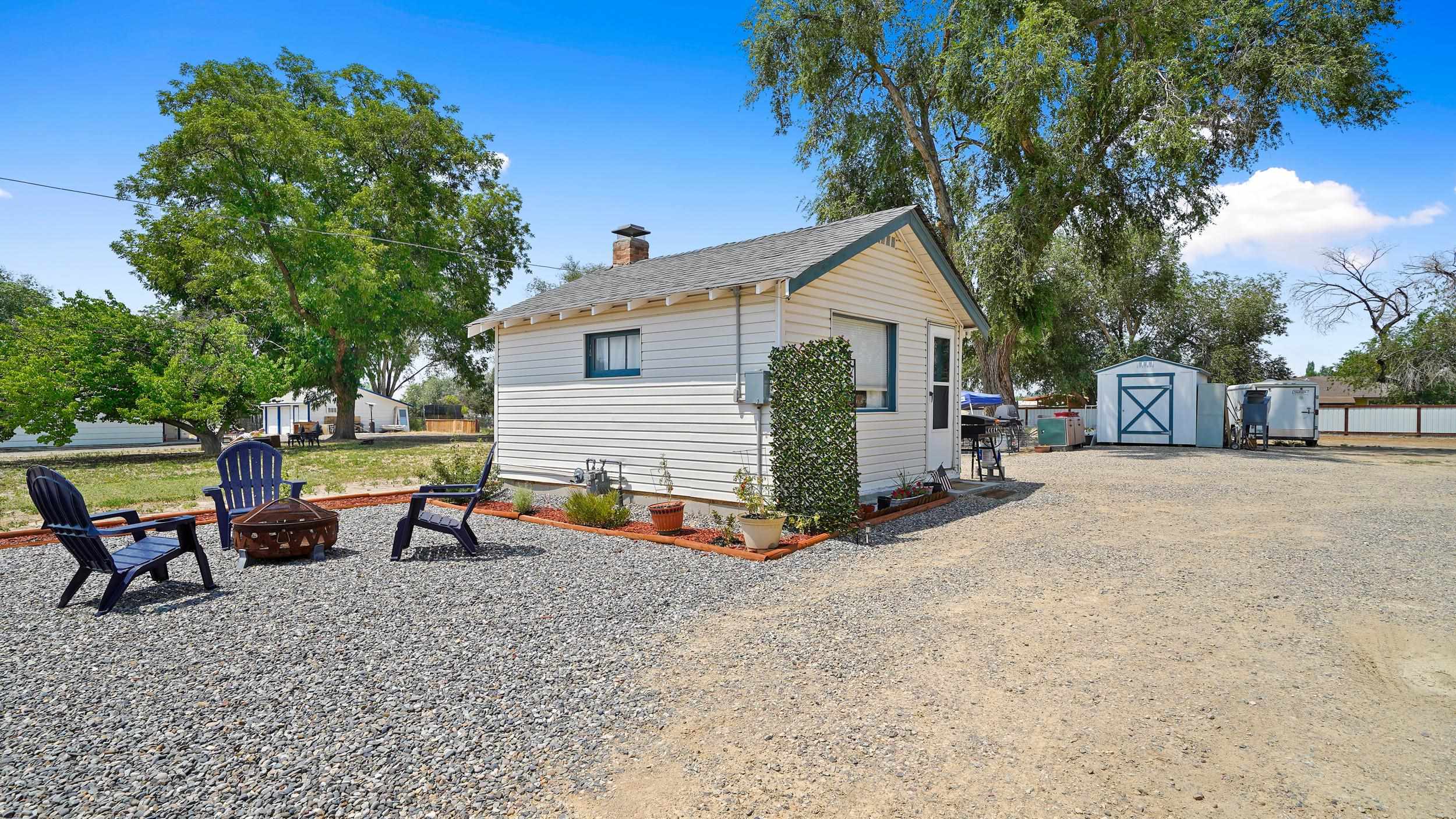 2396 H Road Grand Junction, CO 81505 - Photo 16 of 30 a view of a house with backyard and chairs