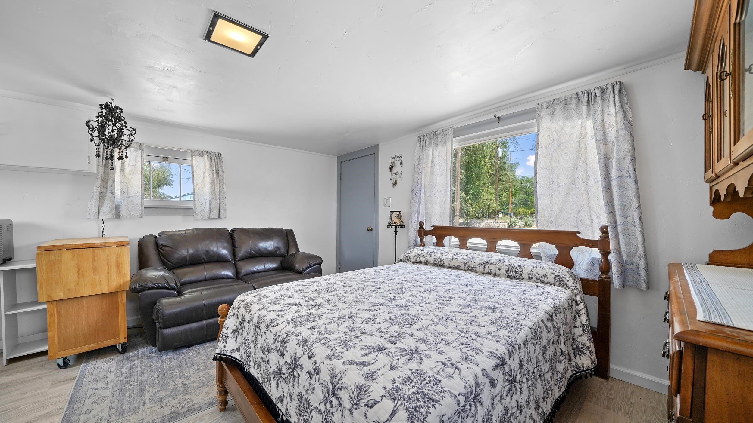 2396 H Road Grand Junction, CO 81505 - Photo 19 of 30 a bedroom with a bed and a couch