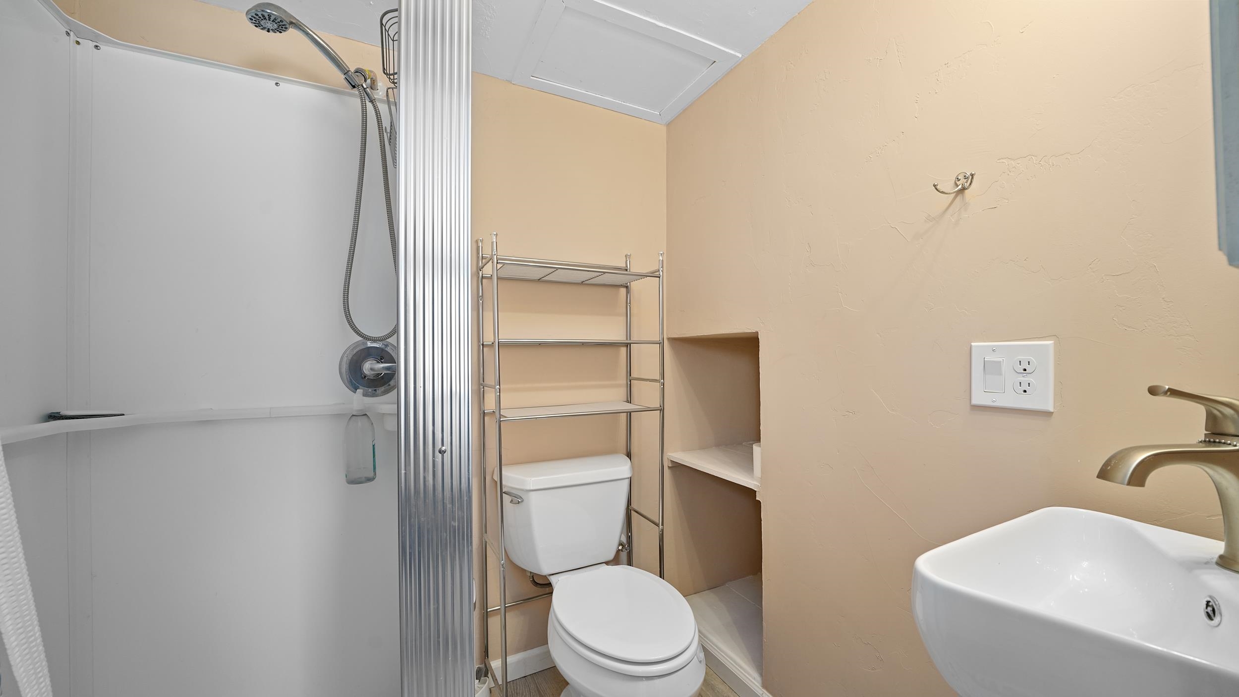 2396 H Road Grand Junction, CO 81505 - Photo 21 of 30 a white toilet sitting next to a bathroom sink