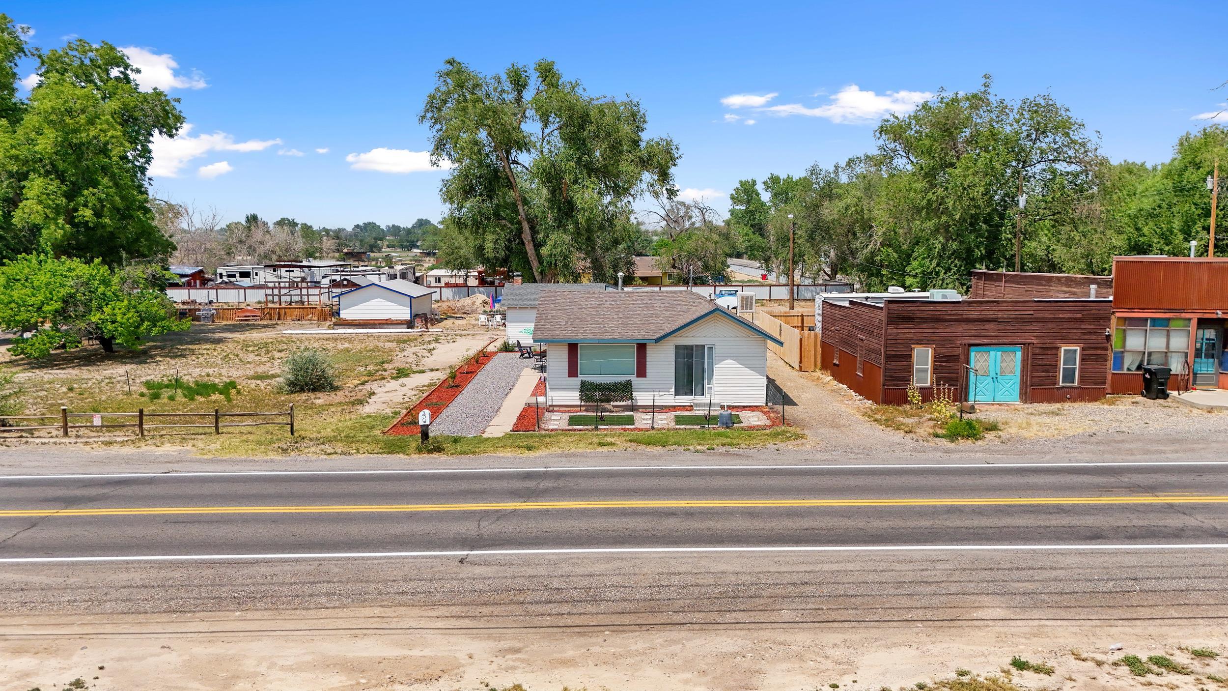 2396 H Road Grand Junction, CO 81505 - Photo 22 of 30 front view of a house with a garden