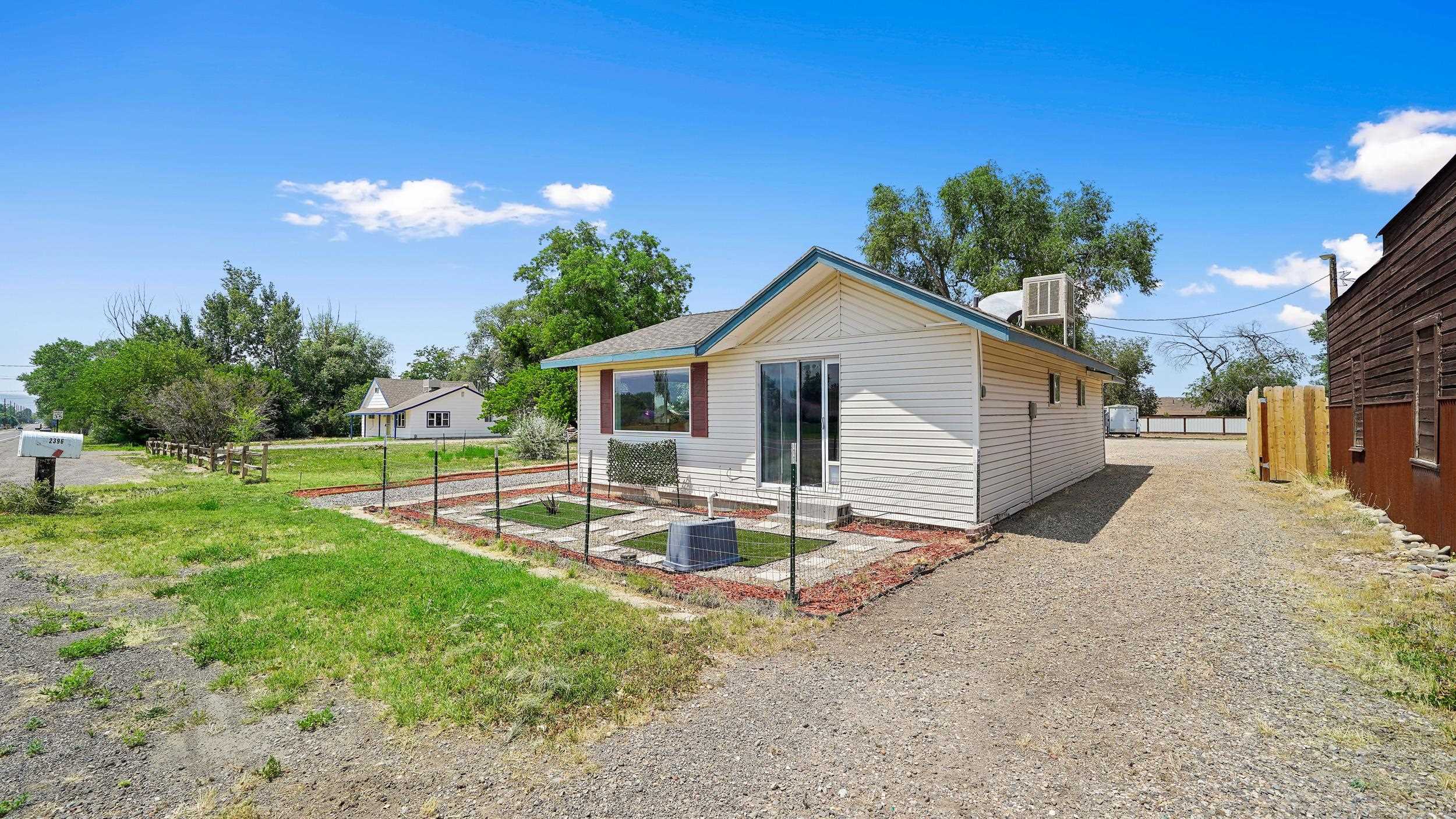 2396 H Road Grand Junction, CO 81505 - Photo 23 of 30 a view of a house with backyard and sitting area