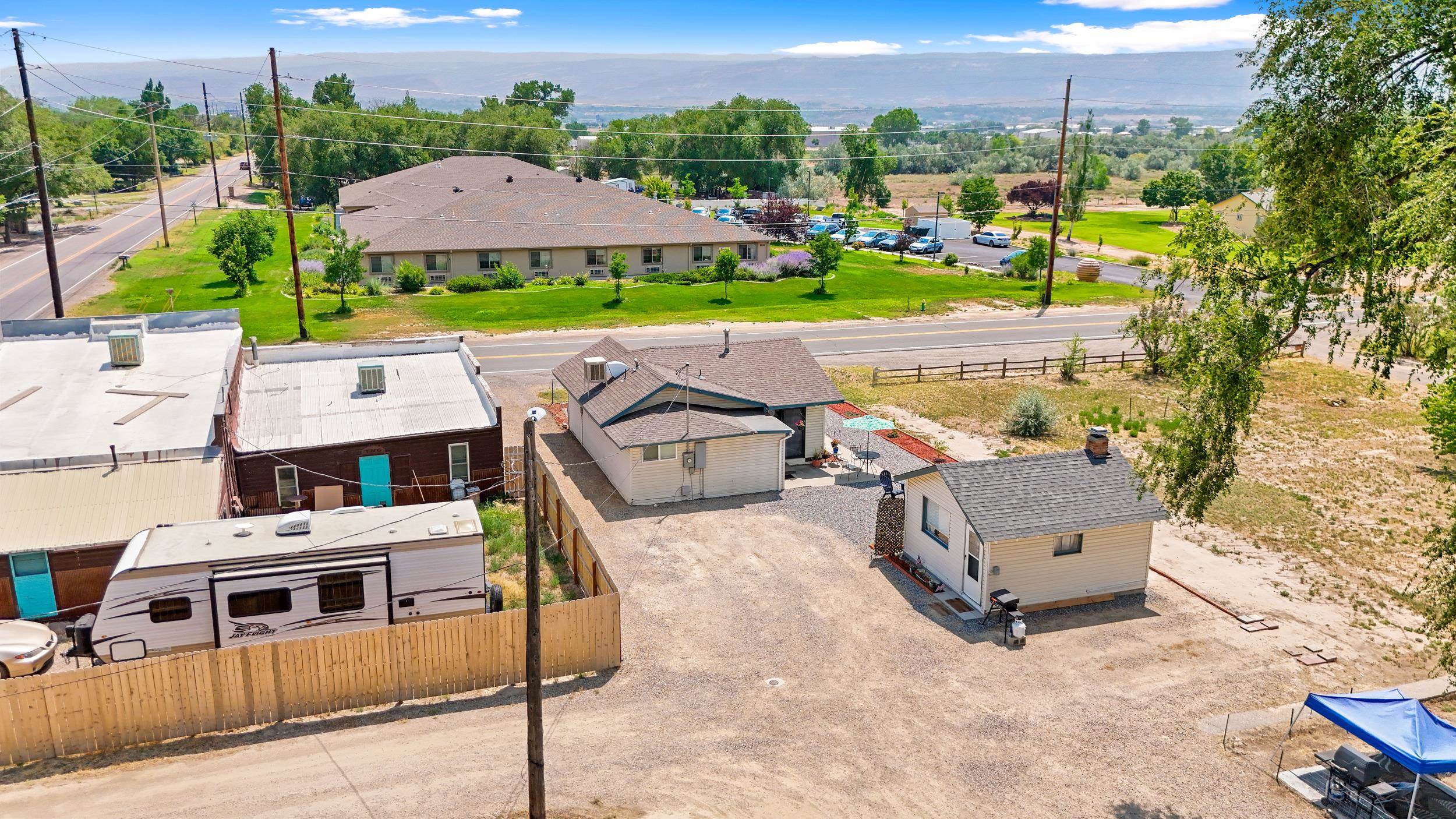 2396 H Road Grand Junction, CO 81505 - Photo 29 of 30 an aerial view of a house with a garden and lake view
