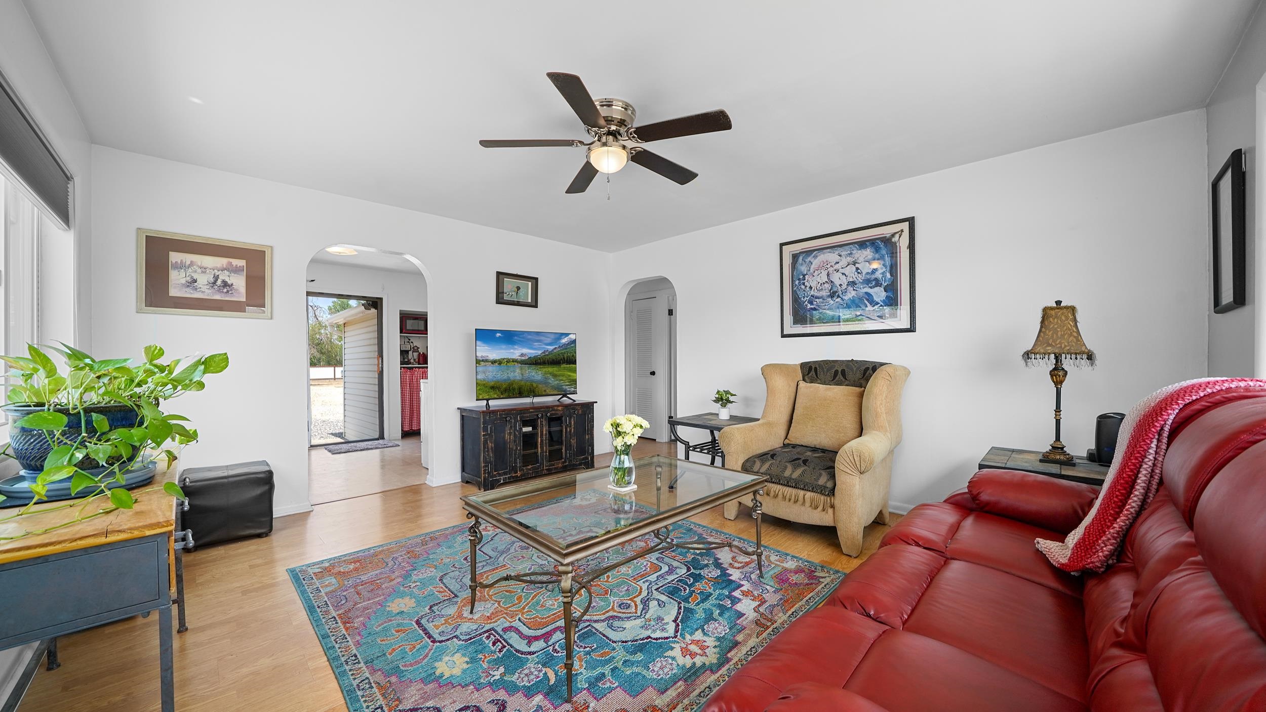 2396 H Road Grand Junction, CO 81505 - Photo 3 of 30 a living room with furniture a ceiling fan and a rug