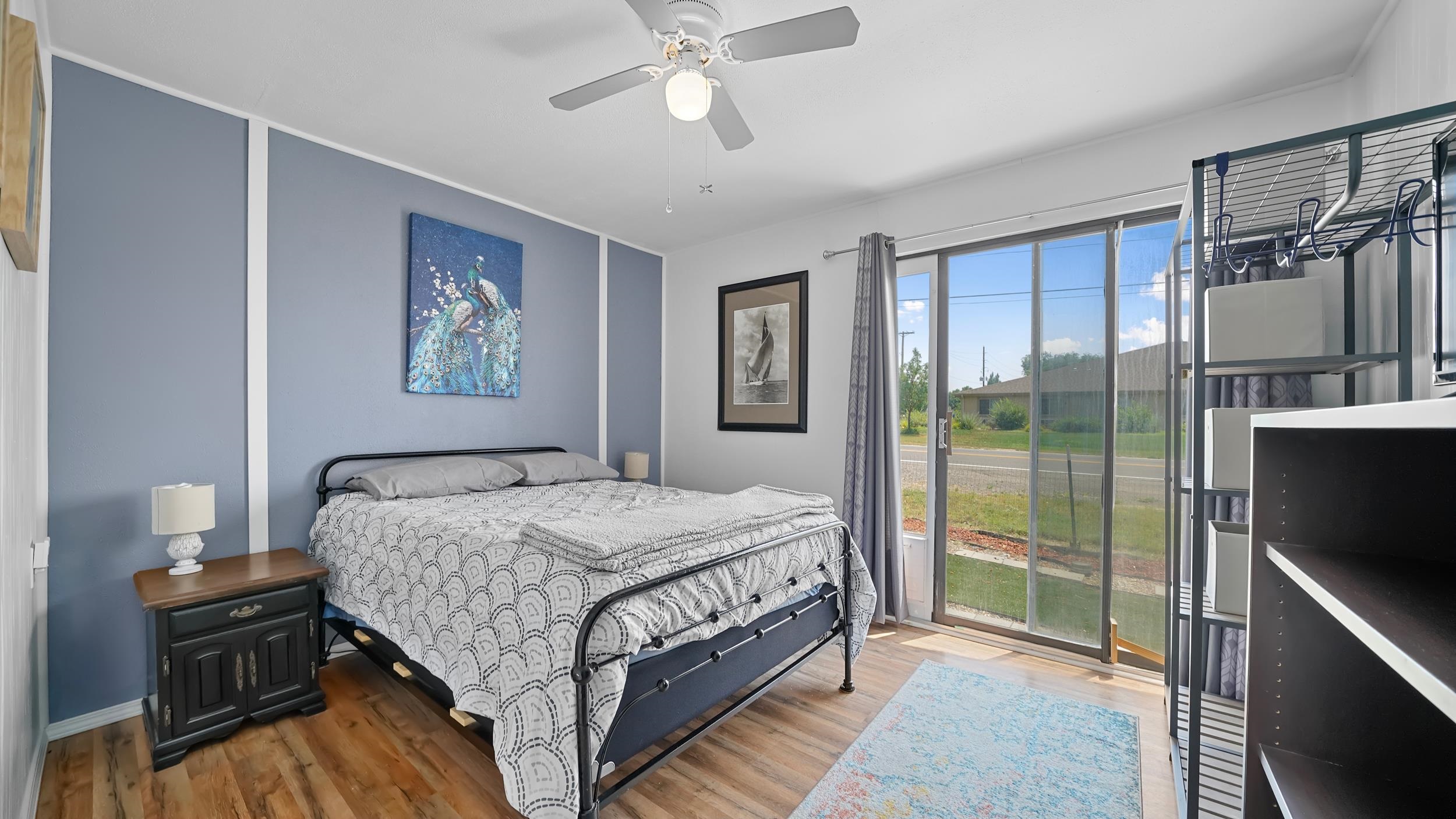 2396 H Road Grand Junction, CO 81505 - Photo 6 of 30 a bedroom with a bed and a flat tv screen on dresser