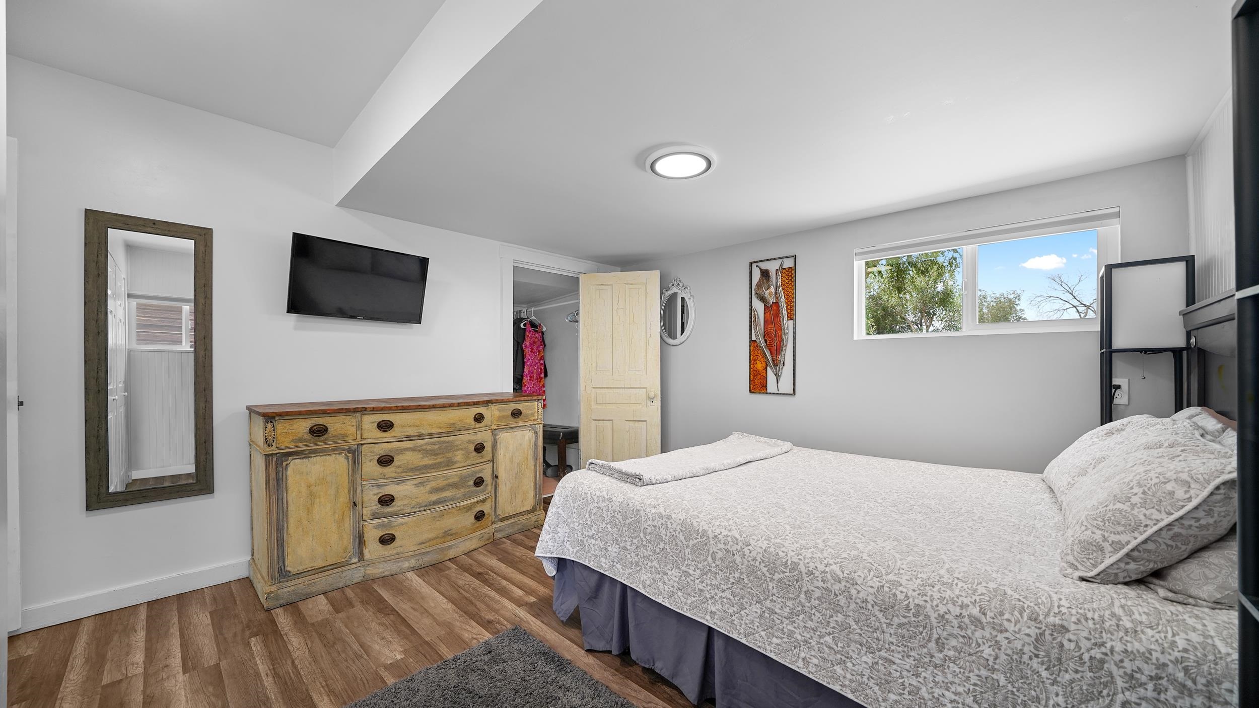 2396 H Road Grand Junction, CO 81505 - Photo 9 of 30 a bedroom with a bed and a flat screen tv
