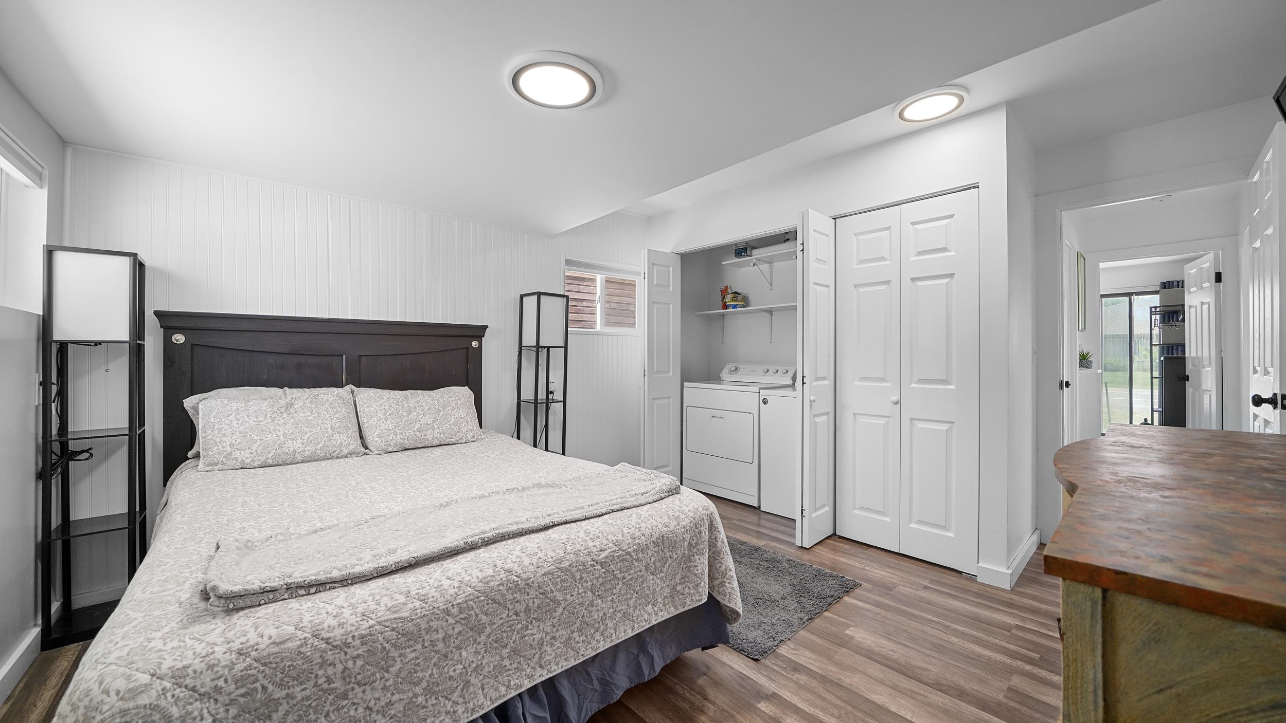 2396 H Road Grand Junction, CO 81505 - Photo 10 of 30 a bedroom with a bed and wooden floor