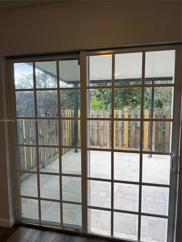 a view of a gate and a window