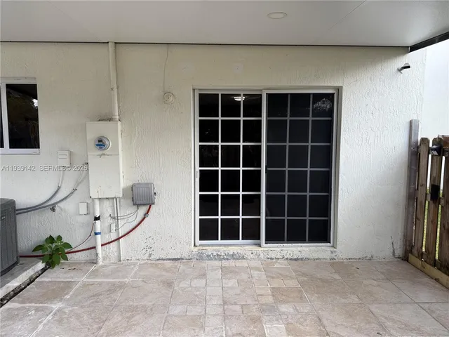 a view of empty room with windows