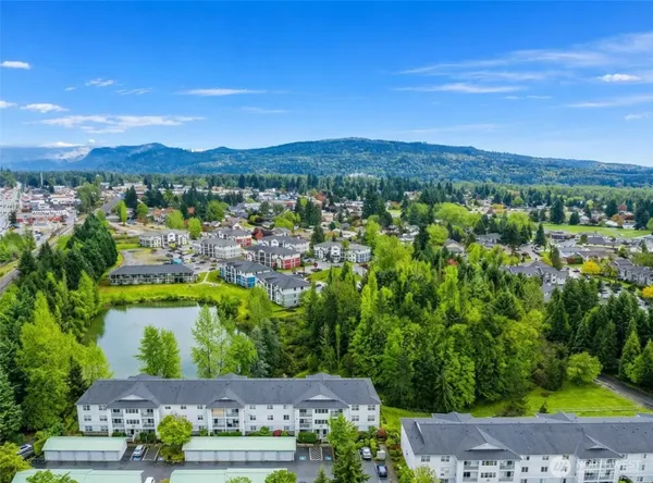 an aerial view of a house with a yard