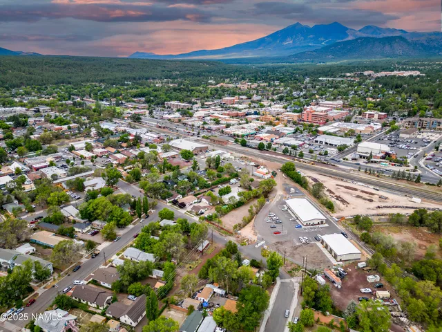 a view of a city with mountains in the background