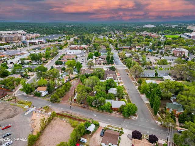 an aerial view of residential houses with outdoor space