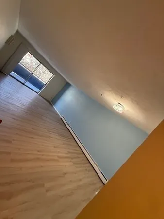 a view of an empty room and window