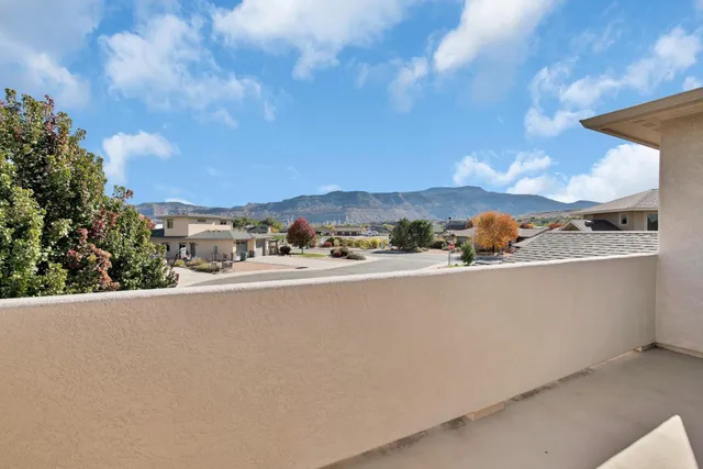 a view of balcony with furniture