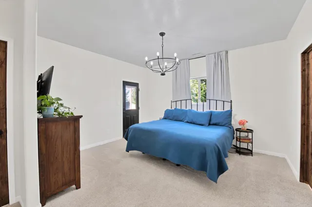 a bedroom with bed and window