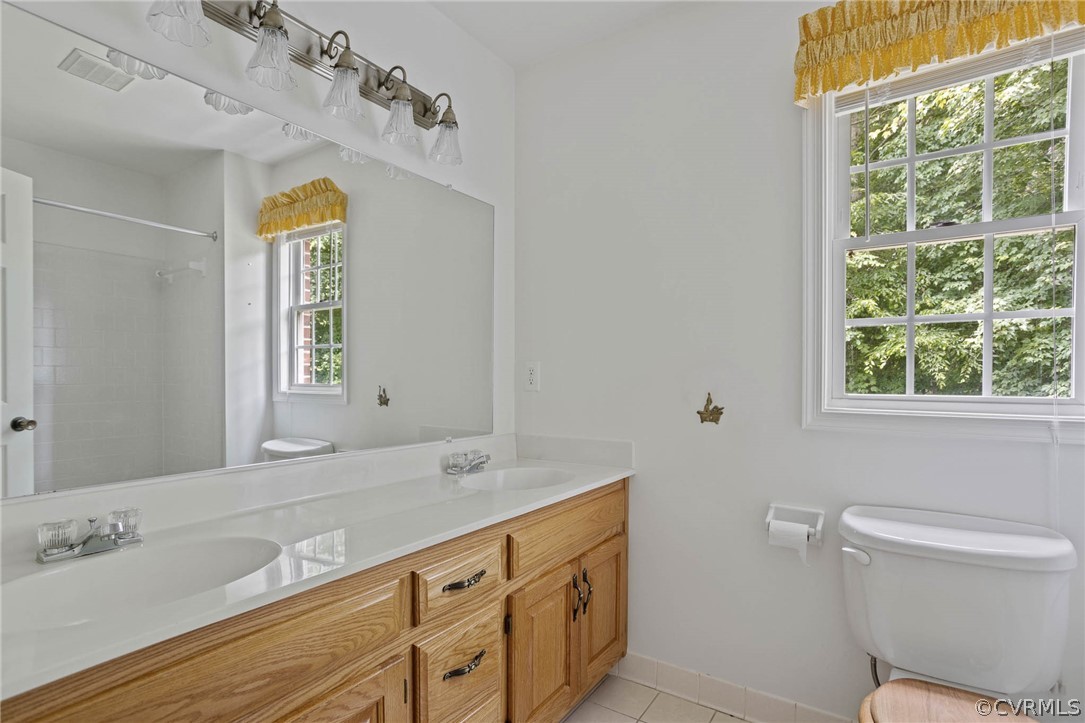 12609 Lilking Road Chester, VA 23831 - Photo 17 of 36 a bathroom with a granite countertop sink mirror and a toilet