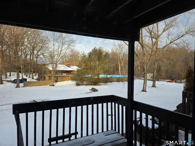 a view of a porch with a yard