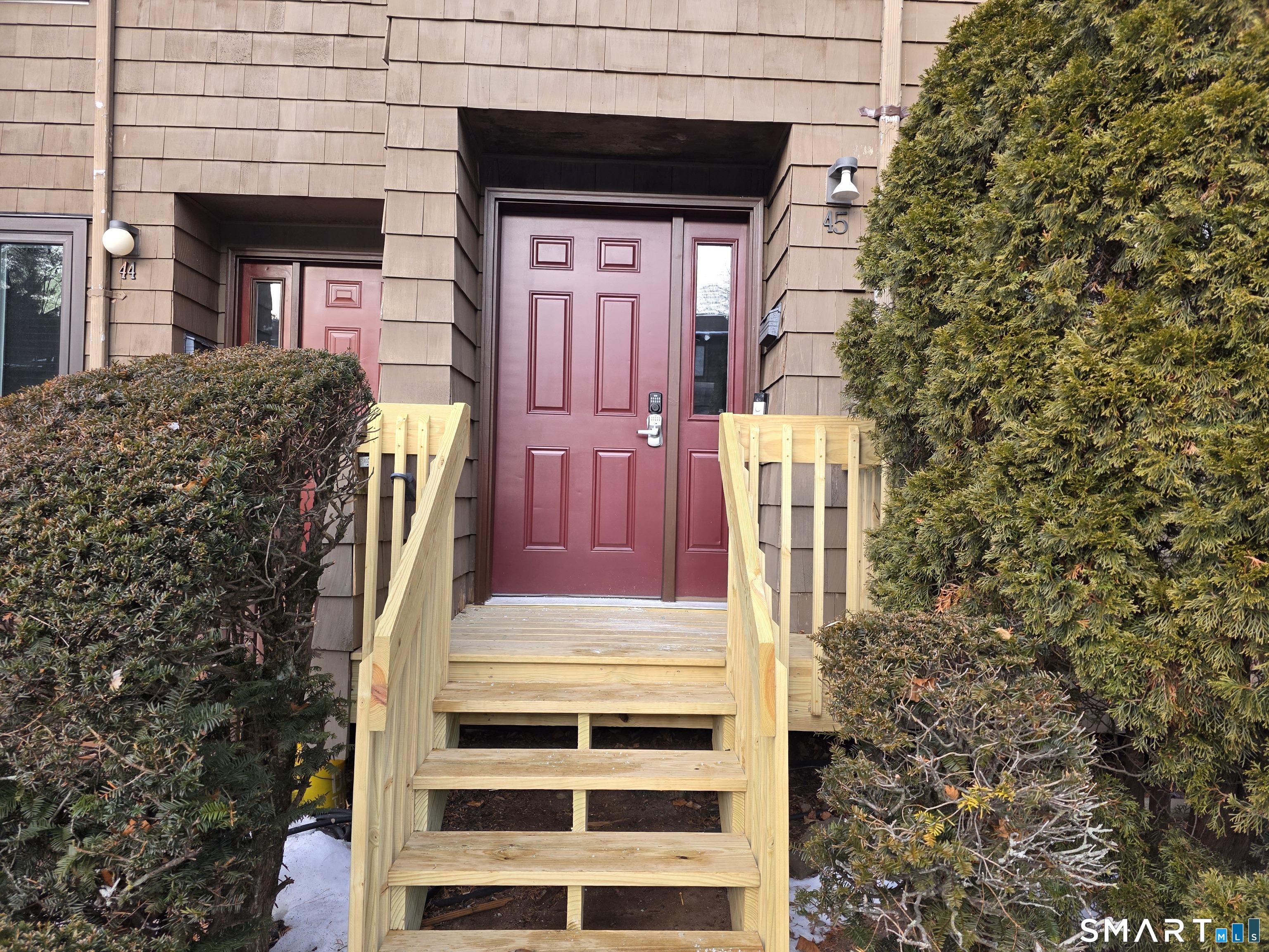 45 Towne House Road, Unit 45 Hamden, CT 06514 - Photo 2 of 23 a view of front door of house with stairs