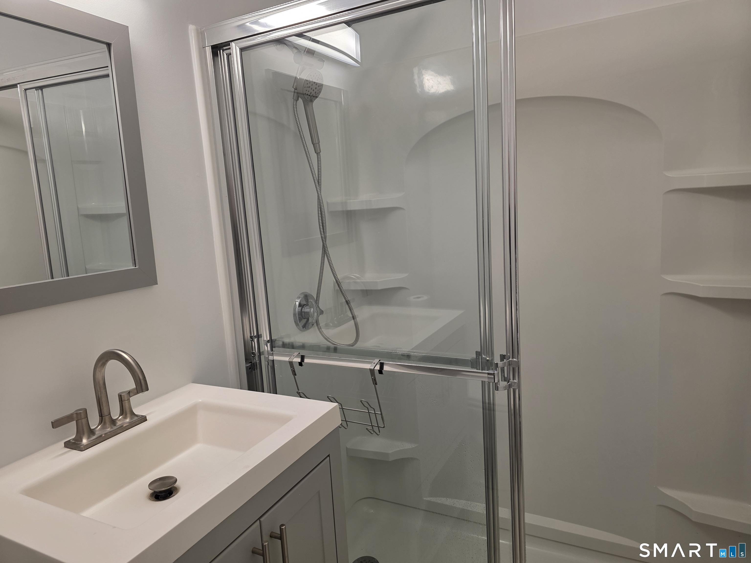 45 Towne House Road, Unit 45 Hamden, CT 06514 - Photo 22 of 23 a bathroom with a sink toilet and shower