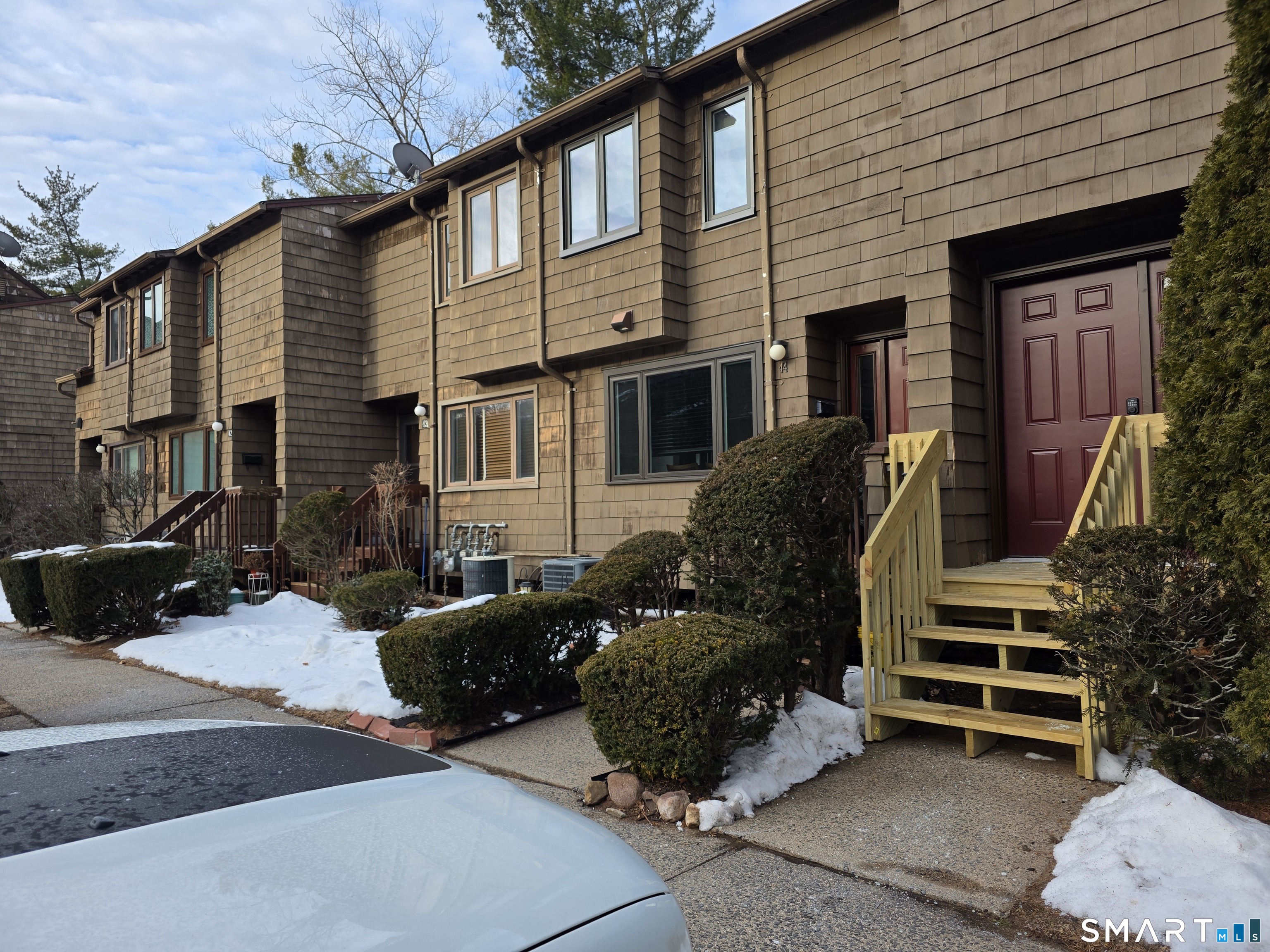45 Towne House Road, Unit 45 Hamden, CT 06514 - Photo 23 of 23 a view of a house with a yard and garage