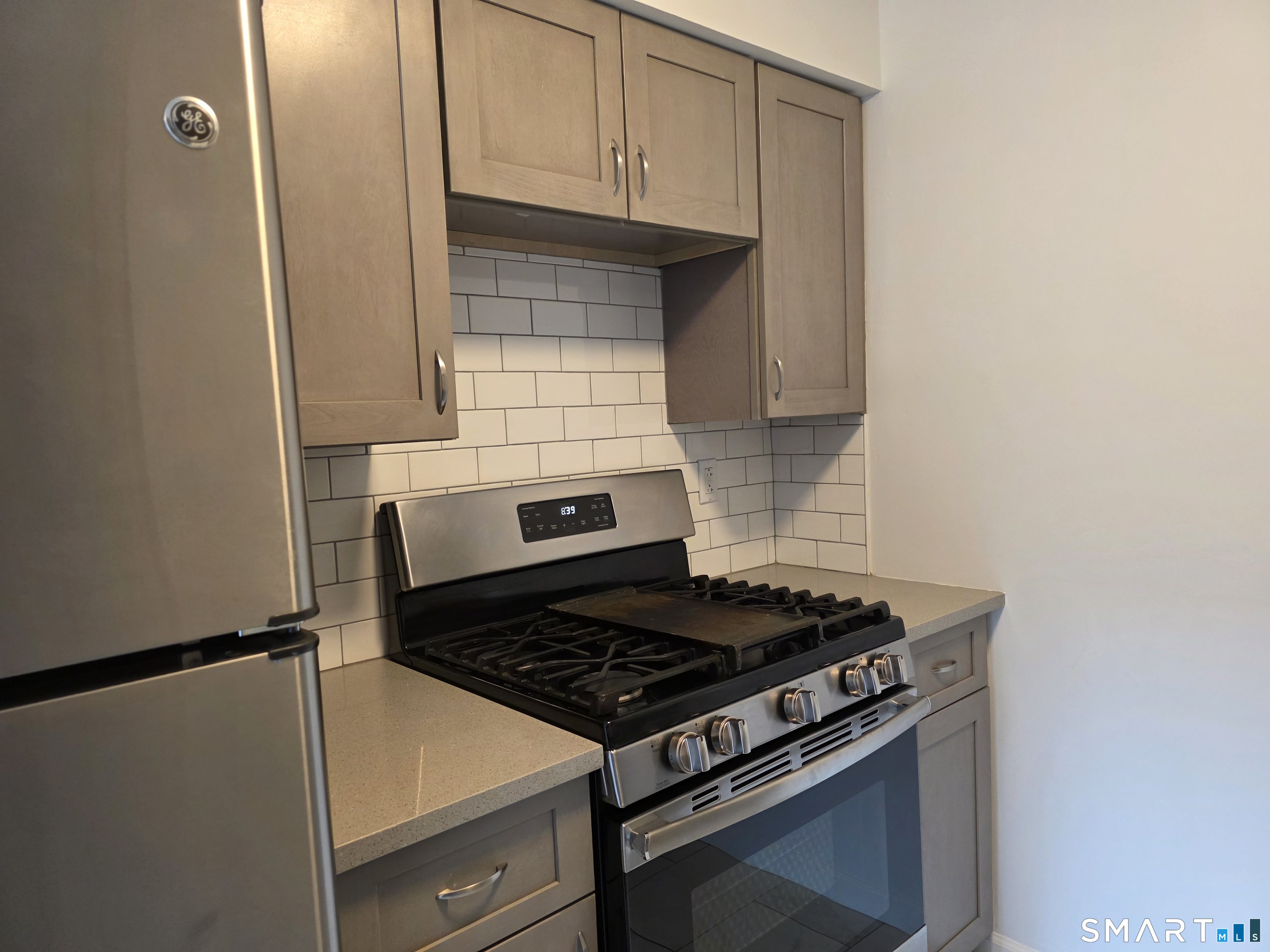 45 Towne House Road, Unit 45 Hamden, CT 06514 - Photo 4 of 23 a stove top oven sitting inside of a kitchen